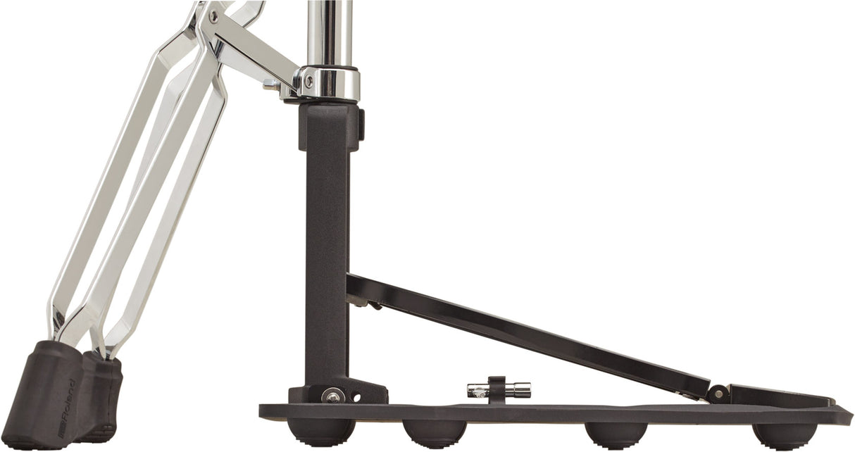 The image shows a chrome-plated drum hardware stand, likely a hi-hat or cymbal stand, featuring adjustable joints with wing nuts and a black rubber foot pad. It has a tripod base with rubber feet to prevent slipping. This professional-grade stand securely holds cymbals at adjustable heights and angles, designed for durability and precise positioning in drum kits during practice and performance.