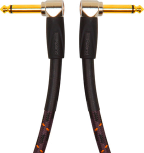 The image shows a high-quality instrument cable with gold-plated 1/4" (6.35mm) right-angle connectors on both ends. It features a black braided jacket with orange/red accents for durability and tangle resistance. The cable has Roland branding on the connector housings. Designed for guitars, basses, and keyboards, it offers reliable signal transmission and a low-profile, strain-reducing fit.
