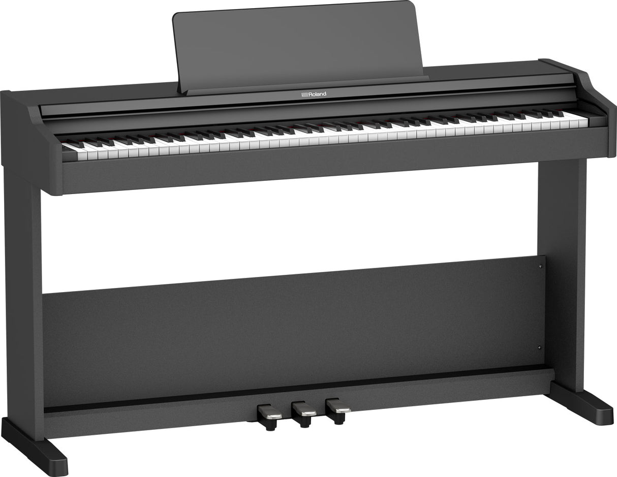 The image shows a Roland digital piano with a full 88-key keyboard, traditional black and white keys, and a dark charcoal finish. It features a built-in music stand, three foot pedals, and a sturdy upright-style cabinet. The Roland logo is visible on the front. Designed to mimic an acoustic piano, it offers weighted keys and digital features like volume control and varied sounds, ideal for home or studio use.