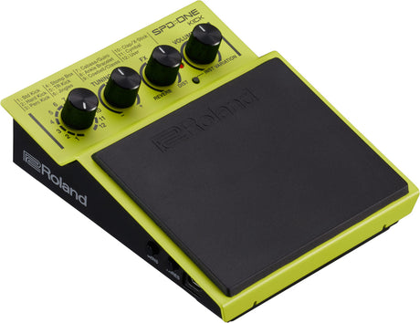 The image shows a Roland SPD::ONE KICK electronic drum pad with a bright yellow-green body and black accents. It features a single large velocity-sensitive rubber pad, four control knobs for tuning, reverb, distortion, volume, and kick sound selection. Designed for kick drum sounds, it offers 12 variations and side input/output ports for easy connectivity, making it portable and suitable for live, studio, and practice use.