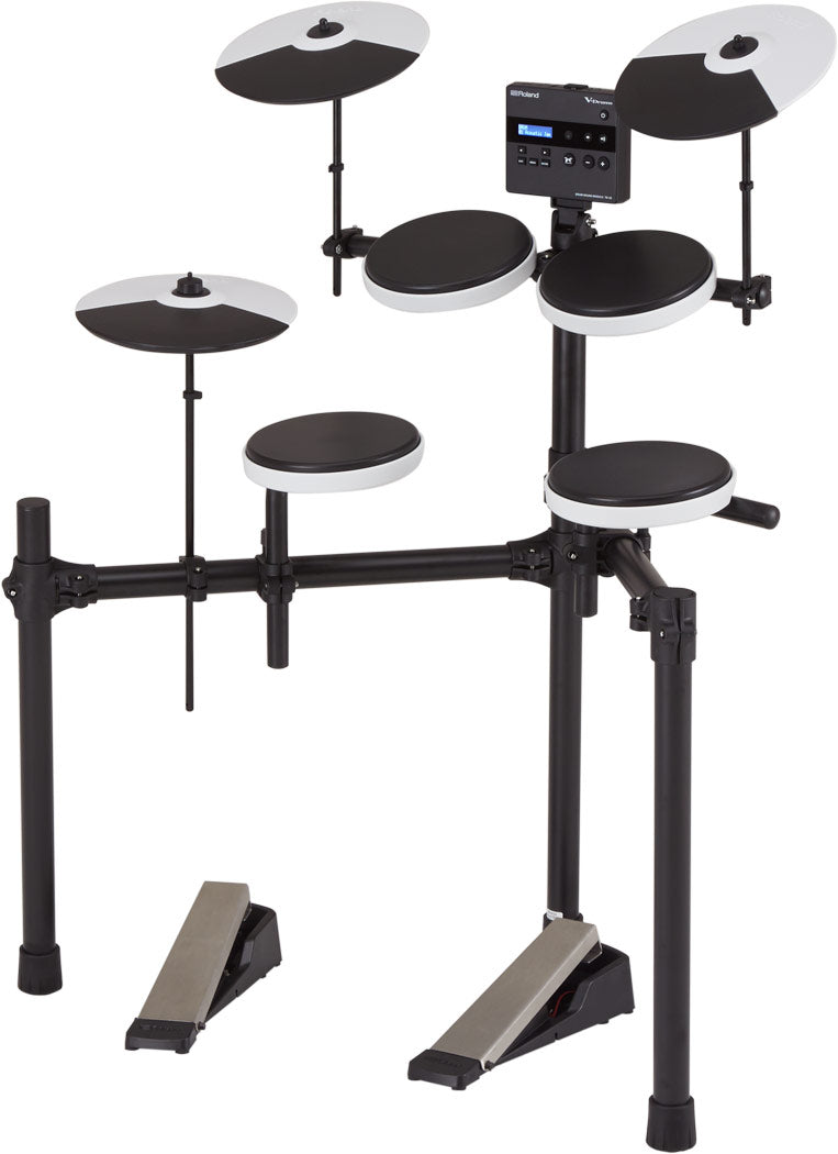 The image shows an electronic drum kit with multiple black and white drum pads, three cymbal pads, a digital sound module with an LCD display, an adjustable metal rack, two bass drum pedals, and connecting cables. It features velocity-sensitive pads, built-in sounds, volume control, headphone output, compact design, and MIDI connectivity. The Roland logo is visible on the sound module.