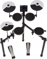 The image shows a complete Roland V-Drums electronic drum kit featuring a central drum module with display, multiple black and silver drum and cymbal pads, cymbal pads on adjustable arms, tom and snare pads, a metal rack system, and foot pedals for bass drum and hi-hat. This modern kit enables silent practice with headphones or amplified play, offering various sounds, metronome, and recording functions for home, studio, or live use.