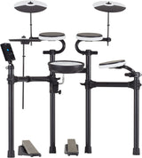 The image shows an electronic drum kit with multiple round drum pads in white and black, two larger cymbal pads at the top, a black electronic module with a display on the left, a black metal rack holding everything, and two foot pedals at the base. This compact kit allows quiet practice, recording, and a variety of sounds, ideal for home use, studios, and live settings.