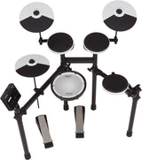 The image shows a Roland V-Drums electronic drum kit featuring multiple black and white drum pads, cymbal pads with sectioned designs, a central white mesh snare pad, and a sturdy black metal rack. It includes an electronic module for sounds and controls, adjustable mounting hardware, and a hi-hat pedal, replicating an acoustic drum set with electronic benefits.