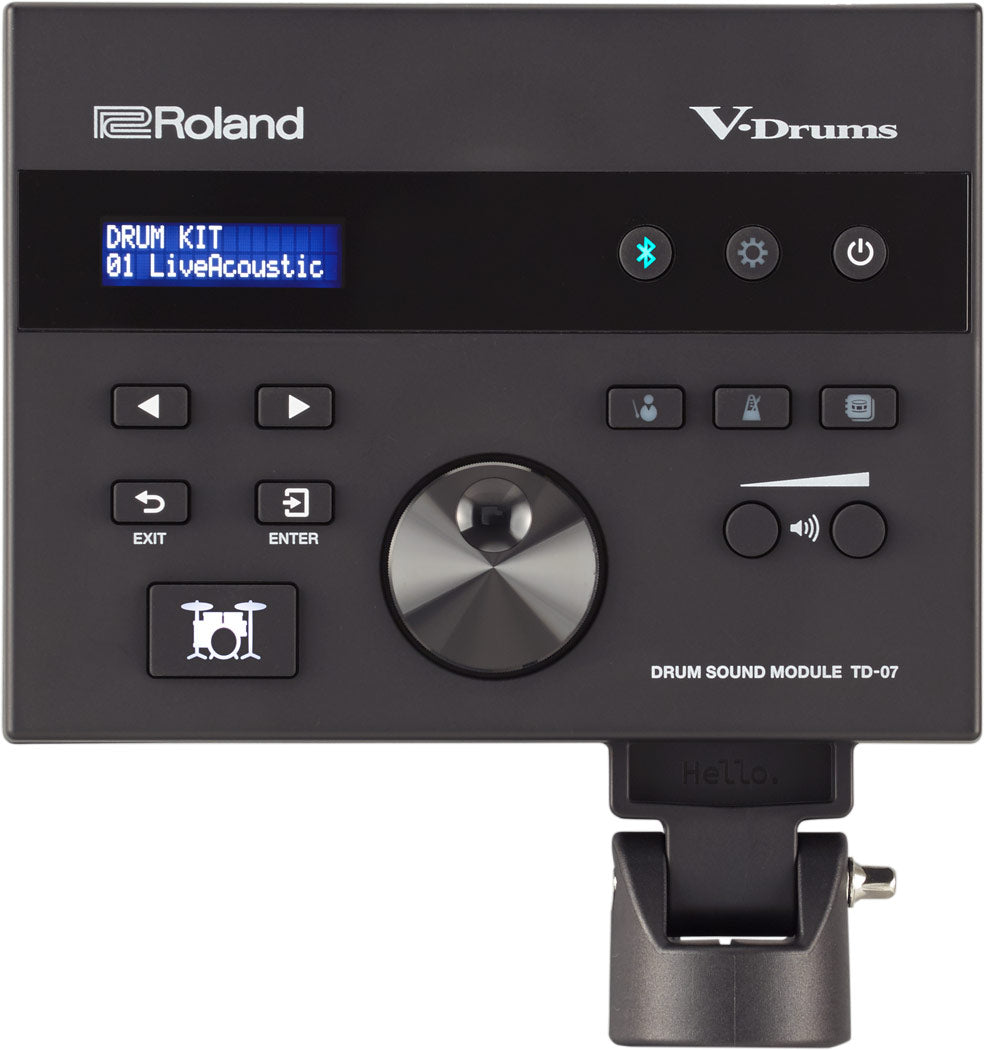 The image shows a Roland V-Drums Drum Sound Module TD-07 with a blue LCD displaying "DRUM KIT 01 LiveAcoustic." It features Roland branding, control buttons (play/pause, arrows, EXIT, ENTER), a central metal-finish dial, volume control, model label, and a mounting bracket. This module connects to electronic drum pads, offering drum sounds, backing tracks, and practice tools for drummers.