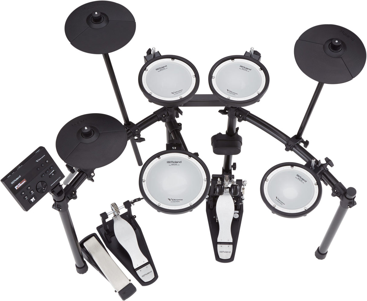 The image shows a Roland electronic drum kit with multiple mesh drum pads, black electronic cymbal pads, a kick drum trigger, hi-hat pedal, and a drum module on an adjustable metal rack. The dual-zone pads and responsive cymbals offer realistic play, while the module provides diverse sounds and settings. This compact kit is ideal for practice, recording, and live use, delivering acoustic-like feel and versatility in a space-saving design.