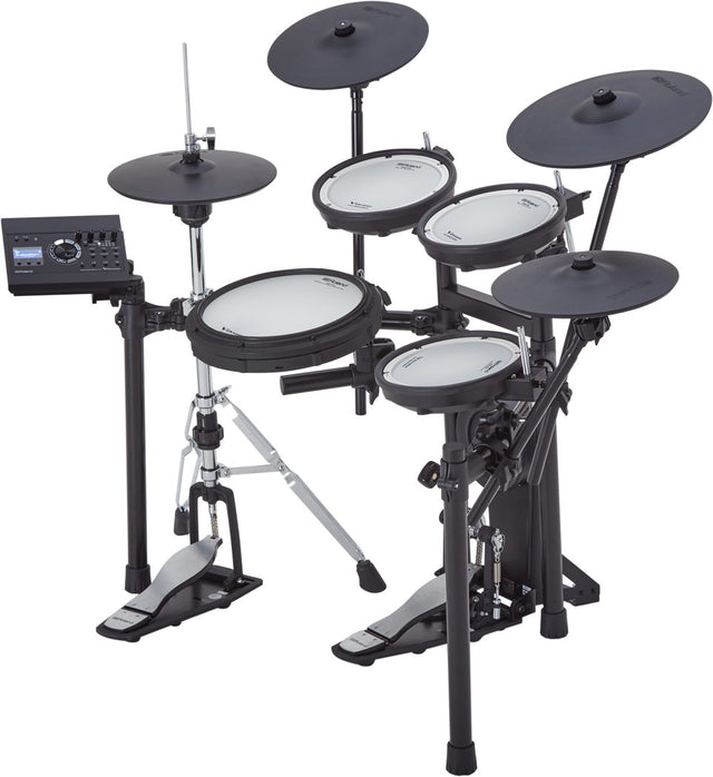 The image shows an electronic drum kit with multiple white mesh drum pads, several black electronic cymbals, a kick drum pedal, and hi-hat pedal. It includes a black sound module for volume and sound settings, mounted on an adjustable metal rack with clamps and tripod legs. This digital kit is compact, quiet for headphone use, versatile for sounds, and suitable for practice, performance, and recording.