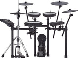 The image shows a complete electronic drum kit with multiple white drum pads, cymbal pads on adjustable arms, a hi-hat pad with controller, a kick drum pad, chrome hardware, and a black drum module on the left. The setup is mounted on a professional metal rack. This kit enables quiet practice, recording, and access to diverse sounds with realistic rubber or mesh pads.