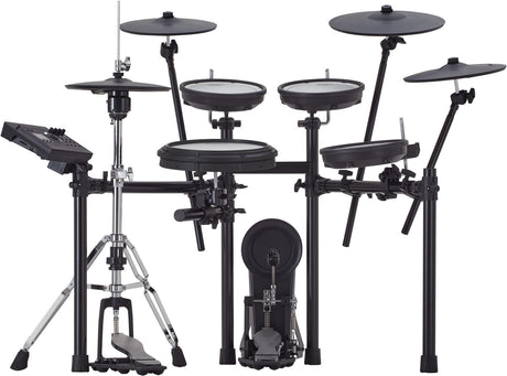The image shows a complete electronic drum kit with multiple white drum pads, cymbal pads on adjustable arms, a hi-hat pad with controller, a kick drum pad, chrome hardware, and a black drum module on the left. The setup is mounted on a professional metal rack. This kit enables quiet practice, recording, and access to diverse sounds with realistic rubber or mesh pads.