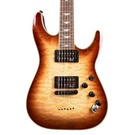 Close-up of a Schecter Omen Extreme - 6 - Limited Edition Electric Guitar with a sunburst finish on a white background. Color starts at as a light cream and gradually gets darker brown to the edges. 
