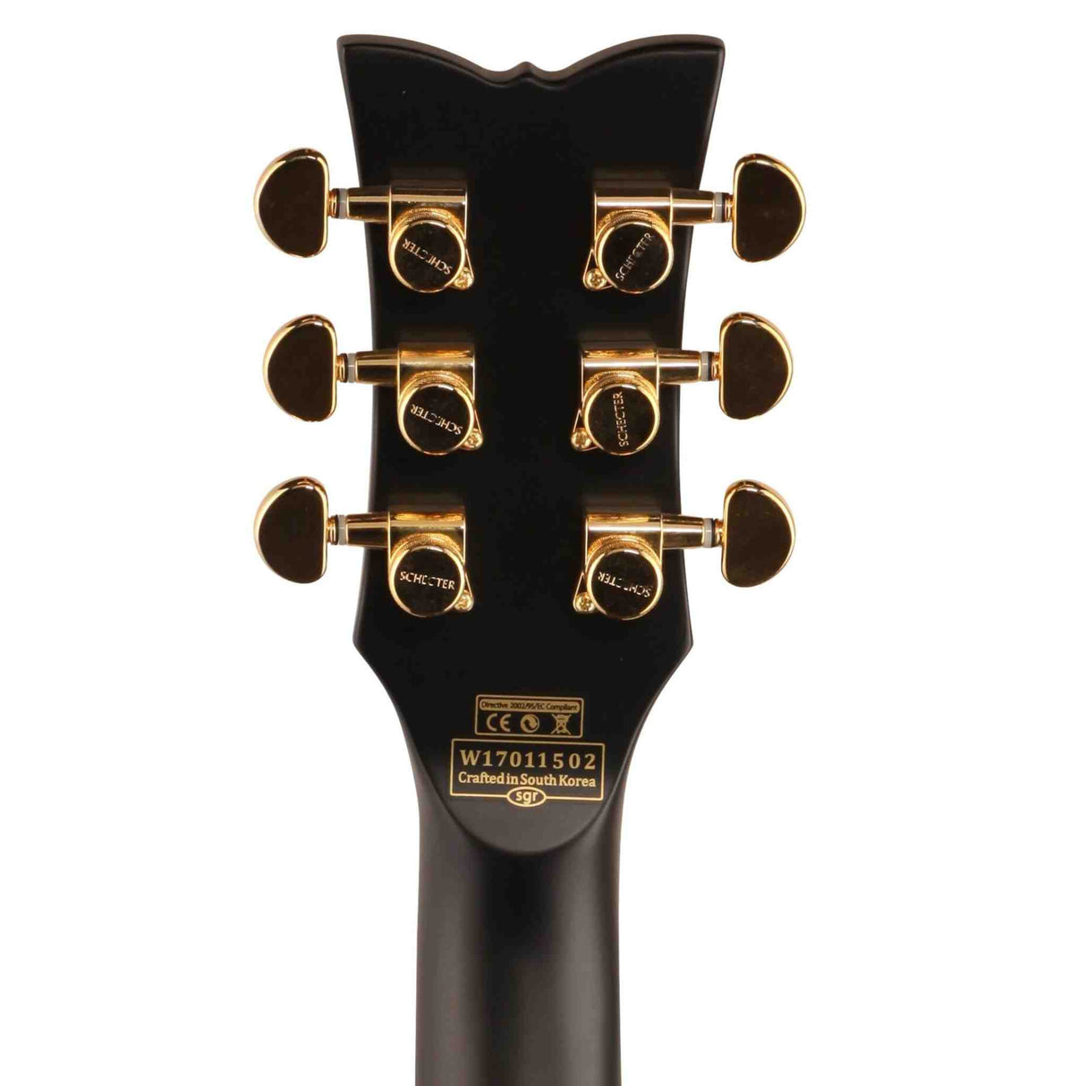 The back of a black Schecter Solo II Custom Electric Guitar headstock. It has gold tuning pegs. 