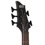 The front of a black Bass headstock with 'Schecter' branding on a white background.