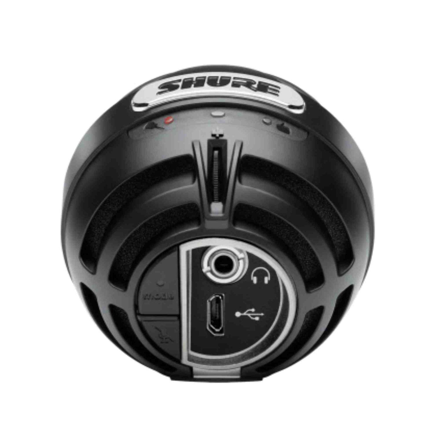 The image shows the bottom/base of a Shure dynamic microphone with the brand name on top. The connection panel includes a USB port and a standard audio output jack, suggesting a USB/analog hybrid model. The microphone features a black, durable design typical of Shure’s professional-grade microphones, known for use in recording, live performances, and broadcasting.