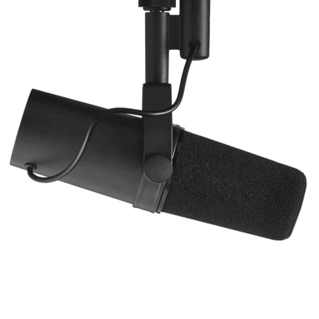 The image shows a professional black dynamic broadcast microphone with a foam windscreen, mounted on an adjustable boom arm with articulating joints. Designed for radio, podcasting, studio recording, and voice-over work, it features durable, high-quality construction. This microphone setup is commonly used for capturing vocals and instruments in studios, live broadcasts, and home recording environments.