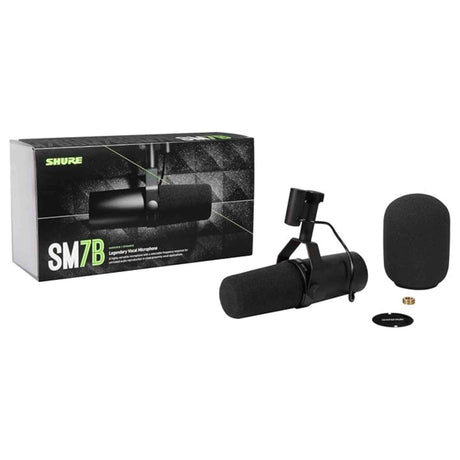 The image shows the Shure SM7B dynamic microphone alongside its black packaging and included accessories. Visible are the microphone’s rugged black design, foam windscreen, and integrated shock mount. The SM7B is a renowned vocal mic used in studio recording, broadcasting, and instrument capture, praised for its warm sound and noise rejection.