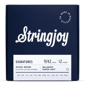 The image shows a package of Stringjoy Signatures series 12-string electric guitar strings, gauge 9/42, nickel wound, labeled "Balanced Super Light." The navy blue box features white elegant script typography, a "Made in Nashville" badge, and a minimalist design. String gauges printed include .009, .012, .015, .008, .024w, .011, .032, .042, and .022w, indicating a premium set for 12-string guitars.
