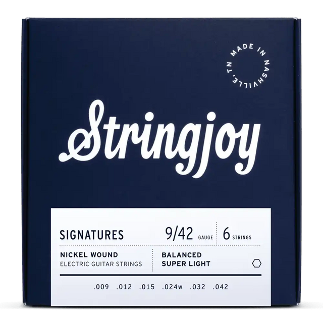 The image shows a package of Stringjoy Signatures series electric guitar strings. It’s a 6-string set with super light 9-42 gauge nickel wound strings featuring balanced tension design. The navy blue packaging has white text and a "Made in Nashville, TN" logo, indicating American-made quality. This set offers consistent tension across strings, favored by lead guitarists for easier bends.