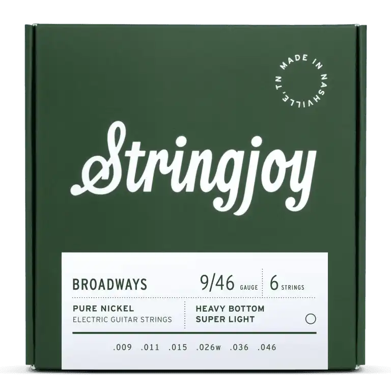 The image shows a green package of Stringjoy Broadways electric guitar strings. It contains a 6-string set of pure nickel hybrid gauge strings (9-46) with heavy bottom and super light treble tension. Gauges are .009, .011, .015, .026w, .036, .046. The box features a Nashville-made stamp and highlights a warm, vintage tone with balanced tension.