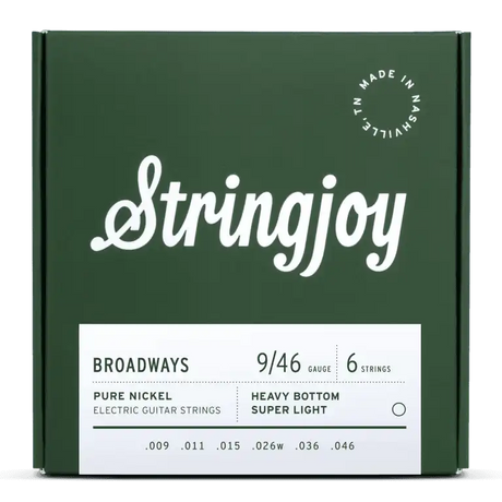 The image shows a green package of Stringjoy Broadways electric guitar strings. It contains a 6-string set of pure nickel hybrid gauge strings (9-46) with heavy bottom and super light treble tension. Gauges are .009, .011, .015, .026w, .036, .046. The box features a Nashville-made stamp and highlights a warm, vintage tone with balanced tension.