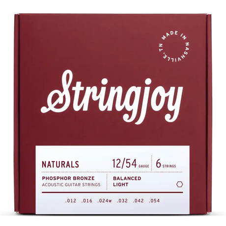 The image shows a package of Stringjoy "Naturals" phosphor bronze acoustic guitar strings, gauge 12-54, balanced light tension. The burgundy box features white script logo, clean typography, and a "Made in Nashville, TN" circular logo. The six strings have gauges .012, .016, .024w, .032, .042, .054. These light gauge strings offer a warm, balanced tone with professional, premium packaging.