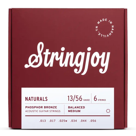 The image shows a package of Stringjoy acoustic guitar strings, medium gauge (.013–.056) phosphor bronze, balanced medium tension. The deep red box features clean white script logo, "Made in Nashville, TN" in the top right, and a minimalist design. The set includes six strings, known for warm tone and durability, from Stringjoy’s "Naturals" line.