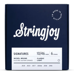 The image shows a dark blue box of Stringjoy "SIGNATURES" electric guitar strings with white script lettering. It features 6 nickel-wound strings, Classic Light gauge 10-46 (.010, .013, .017, .026w, .036, .046), made in Nashville, TN. The packaging is sleek and professional, indicating a premium set that balances playability and tone for electric guitars.