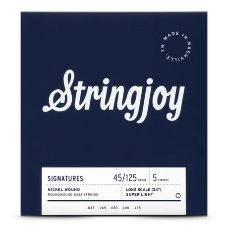 The image shows a package of Stringjoy 5-string bass guitar strings with a 45-125 super light gauge, designed for long scale (34") basses. The deep navy packaging features white cursive branding, a "Made in Nashville, TN" badge, and a white label listing nickel roundwound string specs (.045, .065, .080, .100, .125). This professional set is favored for playability and tone.