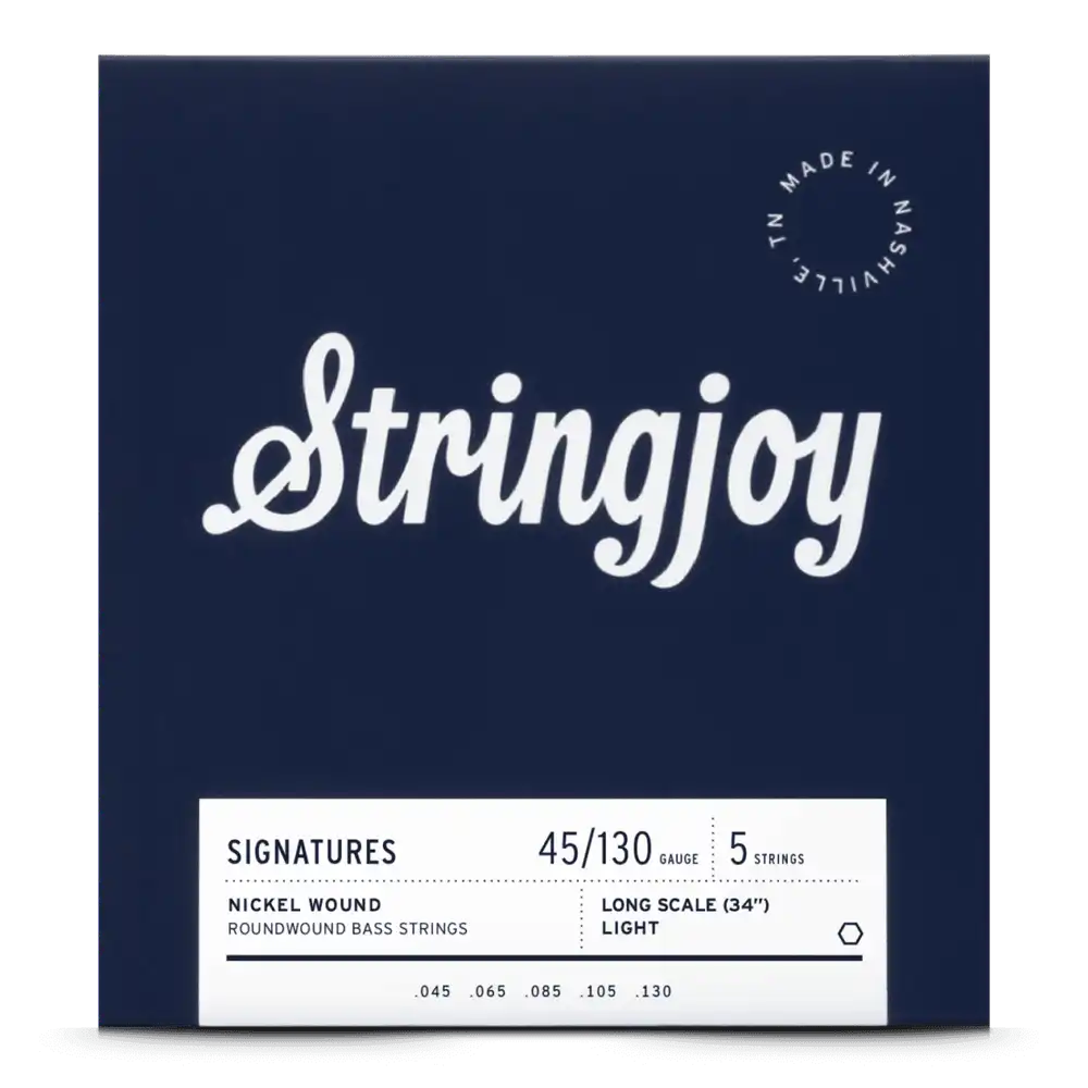The image shows a package of Stringjoy 5-string bass guitar strings with a 45-130 light gauge nickel roundwound set for long scale (34") basses. The packaging features a deep navy background, a white "Stringjoy" logo, a bottom information label, and a "Made in Nashville TN" badge in the upper right corner, indicating premium American-made strings from a boutique brand.