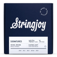 The image shows a package of Stringjoy Signatures Series banjo strings, nickel wound, custom light gauge (10/21), 5-string set for loop-end banjos. The navy blue box features white lettering and a "Made in Nashville" logo. String gauges (.010, .011, .013, .021w, .010) are listed at the bottom. These high-quality, hand-wound strings are made in small batches in Nashville, TN.
