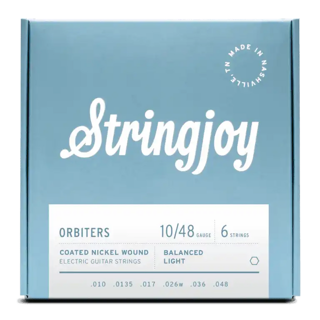 The image shows a package of Stringjoy Orbiters electric guitar strings, gauge 10/48, 6-string set. These are coated nickel wound strings with Balanced Light tension. The packaging features a blue-gray design with white text, a "Made in Nashville" logo in the top right, and the string gauges (.010, .0135, .017, .026w, .036, .048) listed at the bottom. These premium strings offer durability and balanced tension for optimal playability.