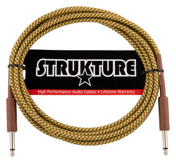 The image shows a Strukture high-performance instrument cable with a gold/yellow braided fabric exterior for durability and style. It features 1/4" TS connectors on both ends, standard for electric guitars, basses, and keyboards. The cable is labeled "High Performance Audio Cable" with a "Lifetime Warranty," highlighting its professional build quality, ideal for live and studio use.