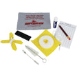 The image shows a musical instrument maintenance kit for lacquered instruments, featuring a gray Superslick microfiber cloth with red text, a blue tube of cork grease, yellow cleaning swabs, various brushes, a practice record sheet with a pencil, and a black mouthpiece cushion. This kit is designed for woodwind instruments like clarinets, saxophones, or flutes to aid in cleaning, lubrication, and care.