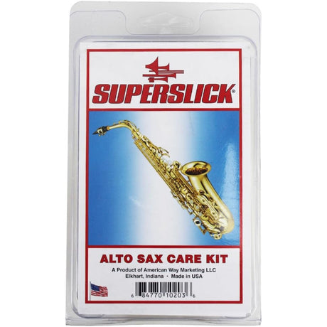 The image shows a Superslick Alto Sax Care Kit package featuring the Superslick red logo and a golden alto saxophone on a blue gradient background. It is in clear clamshell packaging and manufactured by American Way Marketing LLC in Elkhart, Indiana, USA. The kit includes essential saxophone maintenance items like cleaning swabs and cork grease, with a barcode visible for retail scanning.