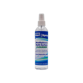 The image shows a clear spray bottle of Superslick SteriSpray, a mouthpiece and multi-surface cleanser for musical instruments. The label highlights it is alcohol-free, fragrance-free, no-rinse, and provides a fine mist spray. It contains 8 fl oz (236 mL) and is used to sanitize mouthpieces of brass and woodwind instruments, helping musicians maintain hygiene and instrument care.