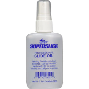 The image shows a 2 fl oz clear plastic spray bottle of Superslick Professional Slide Oil for brass instruments. The label features a blue Superslick logo and a safety warning about petroleum distillates. This lubricating oil helps trombone and trumpet slides move smoothly, preventing sticking and ensuring optimal performance and longevity of brass instruments.