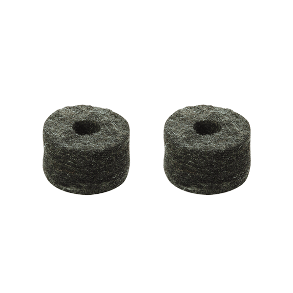 The image shows two small, round, dark cylindrical drum cymbal felts with holes in the center. These felt washers fit over cymbal stand rods, cushioning cymbals from metal contact. They protect cymbals, allow natural movement and resonance, and reduce unwanted noise. The visible dark, fibrous texture is typical of compressed felt, essential for preserving cymbal sound and durability.