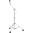 The image shows a chrome cymbal boom stand with a tripod base featuring rubber feet for stability. It has a telescoping main post for height adjustment and an angled boom arm to position cymbals at various angles and distances. Multiple wing nut clamps secure adjustments, and a cymbal holder with a felt washer tops the stand. This stand is used to place cymbals precisely in drum kits without obstructing the drummer.