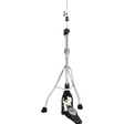 The image shows a hi-hat cymbal stand with a tall, adjustable chrome post, sturdy tripod base with rubber feet, and a black foot pedal featuring a brand logo. It includes clamps and adjustment mechanisms along the post. This essential drum hardware holds hi-hat cymbals (not shown) and allows drummers to control cymbal tension and create varied sounds from tight "chick" to open crashes.