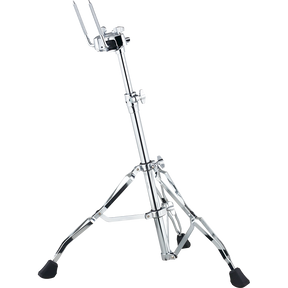 The image shows a chrome-plated hi-hat cymbal stand with a tripod base featuring rubber feet for stability. It has an adjustable telescoping center column, a hi-hat clutch with metal arms to hold cymbals, and a foot pedal at the base to open and close the cymbals. This durable, professional-quality stand is essential for drum kits, allowing drummers to control cymbal sounds by pressing the pedal to close or release to open.