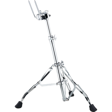 The image shows a chrome-plated hi-hat cymbal stand with a tripod base featuring rubber feet for stability. It has an adjustable telescoping center column, a hi-hat clutch with metal arms to hold cymbals, and a foot pedal at the base to open and close the cymbals. This durable, professional-quality stand is essential for drum kits, allowing drummers to control cymbal sounds by pressing the pedal to close or release to open.