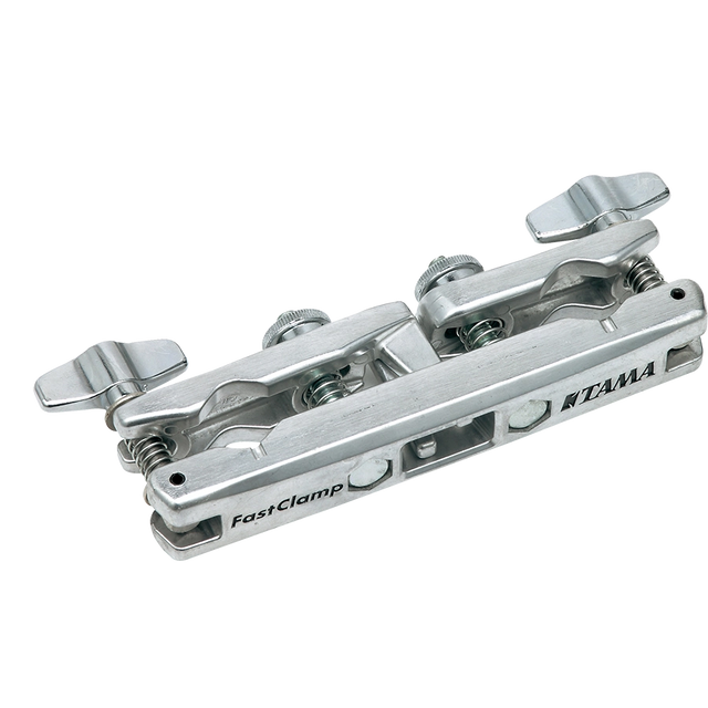 The image shows a Tama FastClamp, a polished chrome drum hardware clamp designed to mount percussion accessories like cowbells or woodblocks. It features Tama branding, dual adjustable wing nuts for secure attachment, and multi-angle adjustment for precise positioning. This professional-grade clamp attaches to drum stands or racks, providing reliable, quick setup for expanding drum kits with additional instruments.