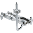The image shows a chrome multi-clamp drum hardware accessory designed to attach to drum or cymbal stands and racks. It features a main clamp for cylindrical rods, an adjustable arm with a ball joint for positioning, a secondary clamp for mounting additional hardware, and wing nuts for secure adjustments. This clamp helps drummers maximize space by mounting multiple components on a single stand.