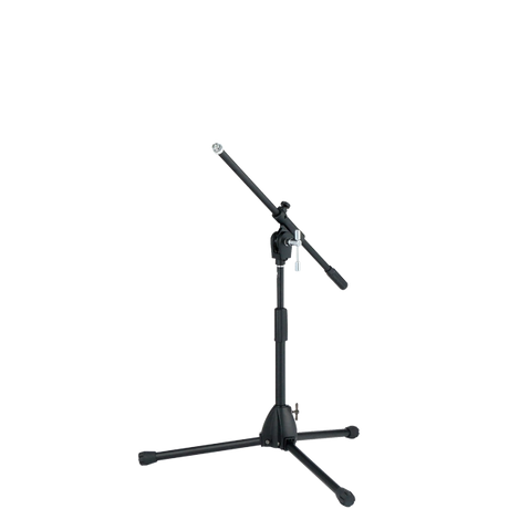 The image shows a professional black microphone stand with a tripod base and an adjustable boom arm. It has multiple height and angle adjustment points with locking mechanisms for stability. This versatile stand is commonly used by musicians, vocalists, and audio engineers to position microphones for recording, live performances, and studio work.