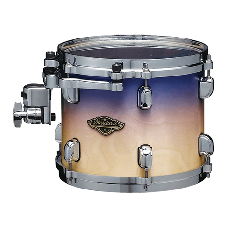 The image shows a mounted tom-tom drum with a gradient finish fading from deep blue to cream. It has chrome hardware, including tension rods, lugs, and a mounting bracket. A "Starclassic" badge on the shell indicates it’s a Tama drum from their Starclassic series. This drum is part of a larger kit, mounted on a stand or rack, with a professional look suitable for stage or studio use.