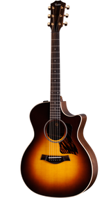 The image shows a Taylor acoustic-electric guitar with a Grand Auditorium cutaway body. It features a sunburst finish, dark wood back and sides, a round soundhole with rosette, tortoiseshell pickguard, and gold tuning machines. The dark fretboard has dot markers, and the cutaway allows easy access to higher frets. This high-end model highlights premium craftsmanship and materials typical of Taylor Guitars.