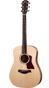 The image shows a Taylor acoustic guitar with a natural wood finish and classic dreadnought shape. It features six tuning pegs, a tortoiseshell pickguard, a black bridge with a compensated saddle, and a rosewood or ebony fretboard with dot markers. The headstock displays the Taylor logo. The guitar is photographed against a white background, showcasing Taylor's clean design and quality craftsmanship.