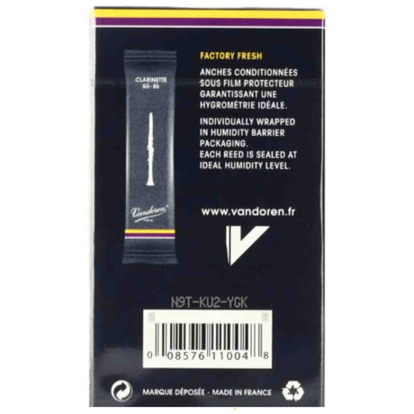 The image shows the back of a Vandoren clarinet reed package for B-flat clarinets. It features the Vandoren logo, website, and key details like "Factory Fresh" individually wrapped reeds sealed at ideal humidity. The packaging is dark with yellow and purple accents, made in France, and includes a product code and barcode. Vandoren is a trusted French brand known for professional-quality woodwind reeds.