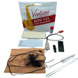 The image shows a Venture Pro-Quality alto saxophone care kit containing essential maintenance tools: a brown chamois cleaning swab with weighted cord, various cleaning brushes including a mouthpiece brush, a tube of cork grease, a polishing cloth, and a care instruction card with fields for personal info. This starter kit helps keep the saxophone clean, lubricated, and in good playing condition.