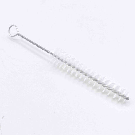 The image shows a cleaning brush for musical instruments, featuring a long, flexible wire handle with a hanging loop and white cylindrical bristles. Its slender design is ideal for cleaning narrow tubes and bores of wind, brass, and woodwind instruments like flutes, clarinets, trumpets, and saxophones. This essential tool helps remove moisture and debris to maintain sound quality and instrument longevity.