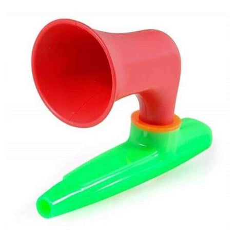 Red and green plastic Wazoo  kazoo on a white background